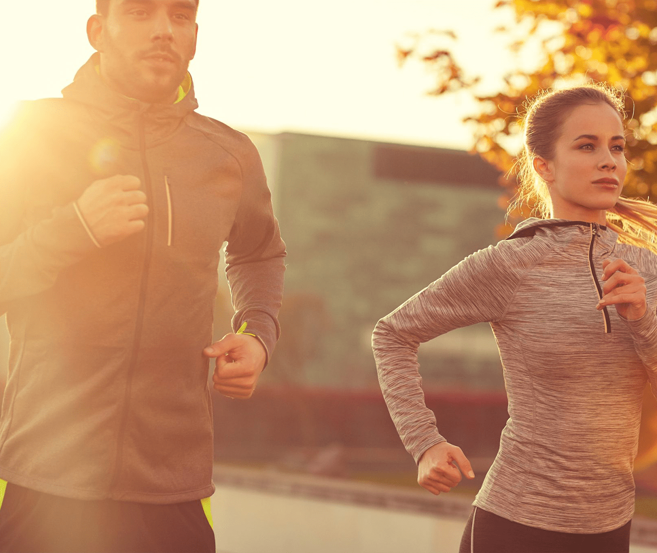 fitness, sport, people and lifestyle concept - couple running outdoors
